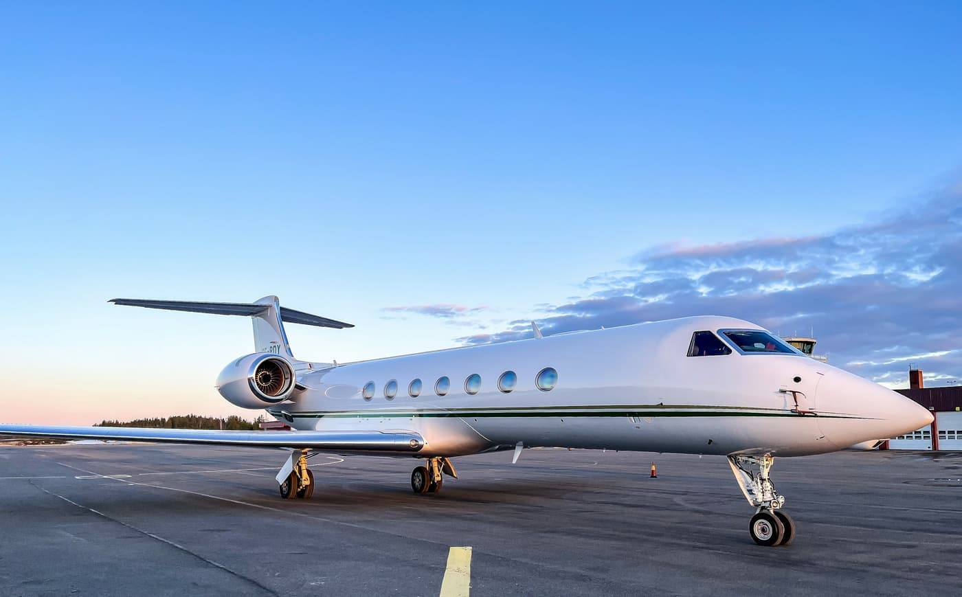 Private jet on the apron at dusk